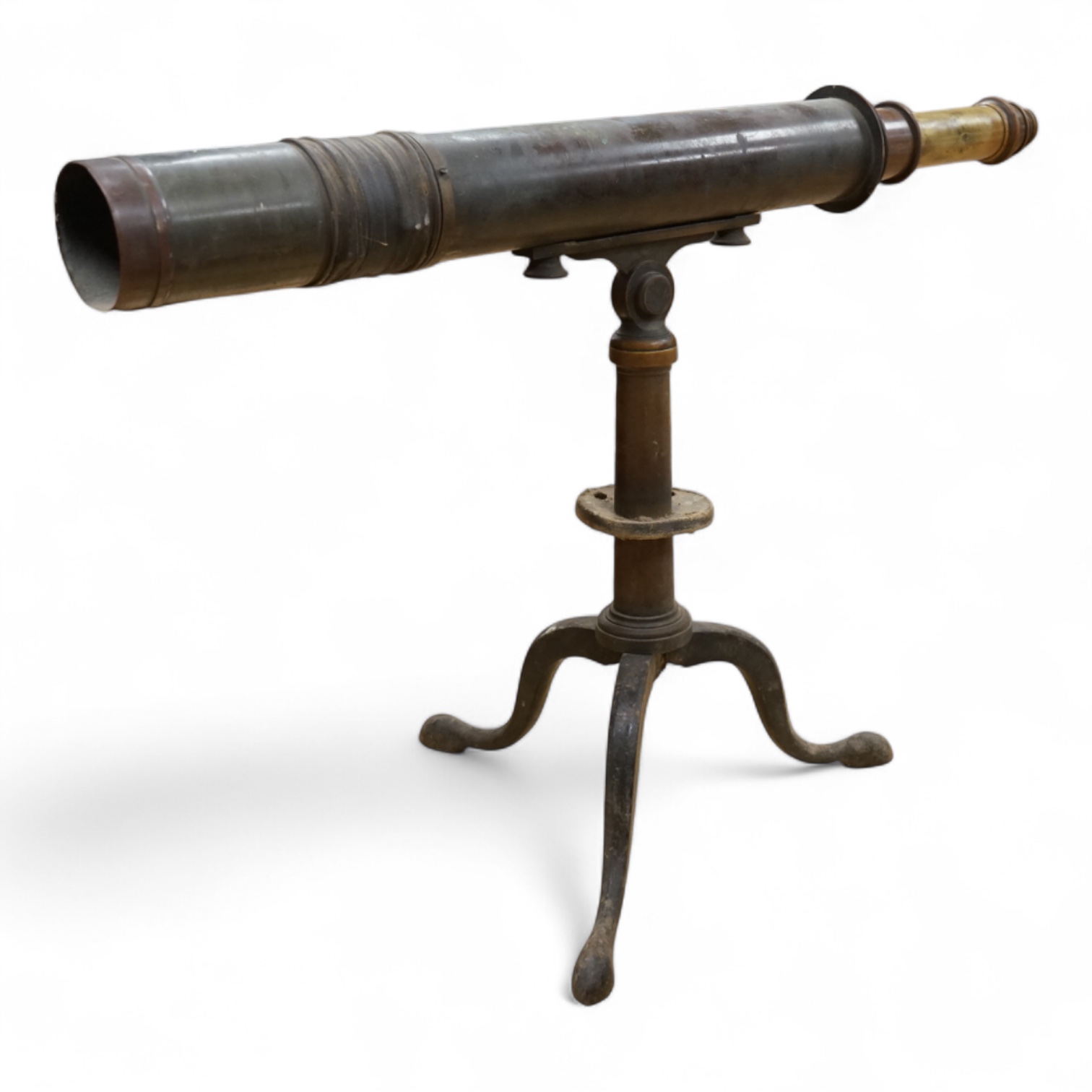 An early 20th century brass two draw telescope on tabletop tripod stand, with engraved dedication; ‘ Computed and Presented by J.W. Gifford. F.R.A.S. Chard 1917’, 73cm long, 48cm high on stand.